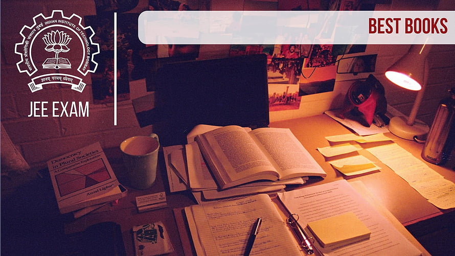 IIT JEE Exam Study Desk with Open Books, Notebooks, and Warm Lamp Light HD wallpaper