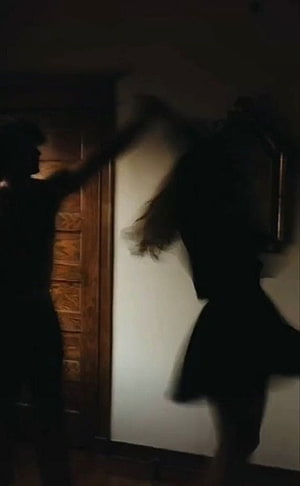 Dark Aesthetic Silhouette of a Couple in Motion Against a Wooden Door HD phone wallpaper