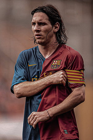 Lionel Messi in Barcelona Home Kit with Long Hair and Captain Armband HD phone wallpaper