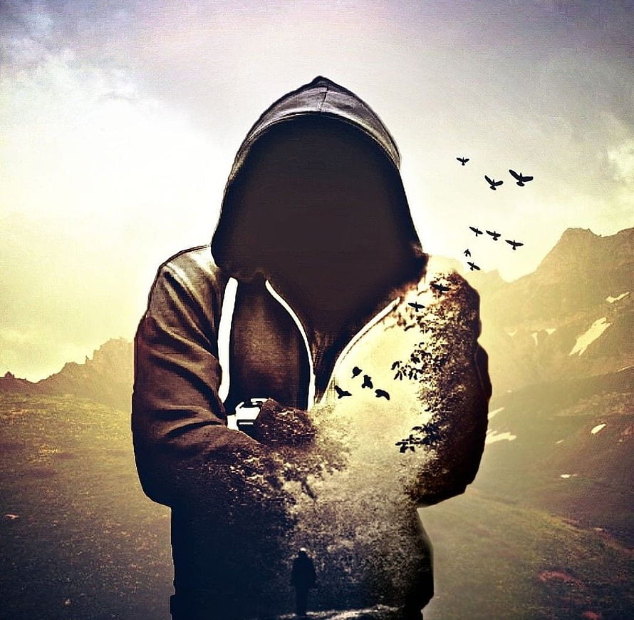 Mysterious Hooded Figure Dissolving Into Birds Against Mountain Landscape HD wallpaper