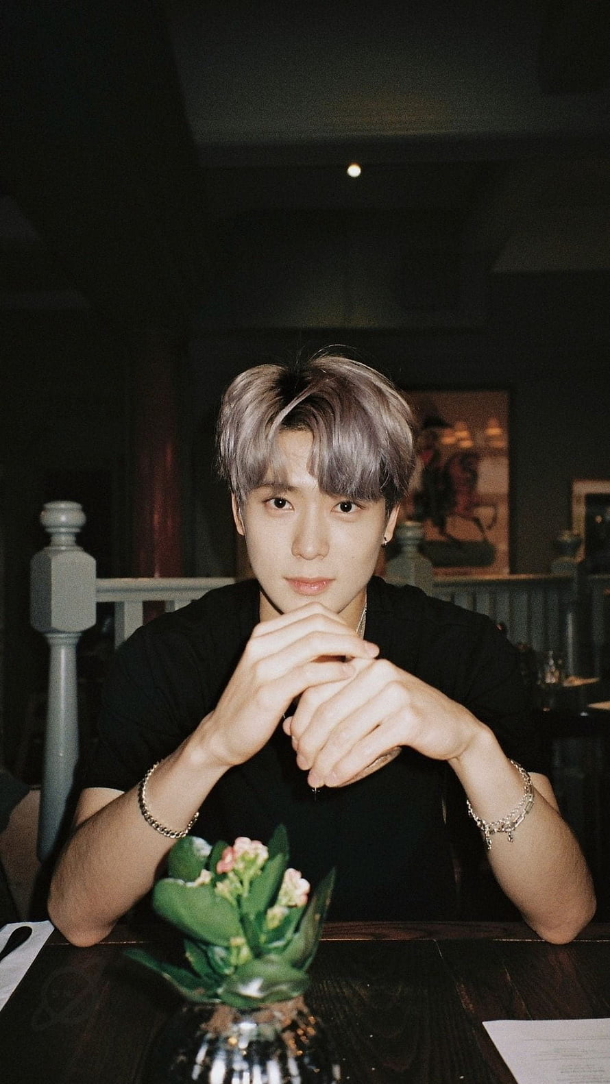 NCT Jaehyun Portrait in Dimly Lit Cafe with Silver Hair and Black Shirt HD phone wallpaper