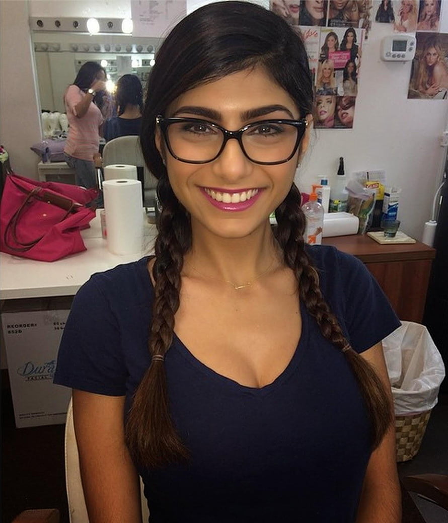 Mia Khalifa Smiling in Salon with Braided Hair and Black Glasses HD phone wallpaper