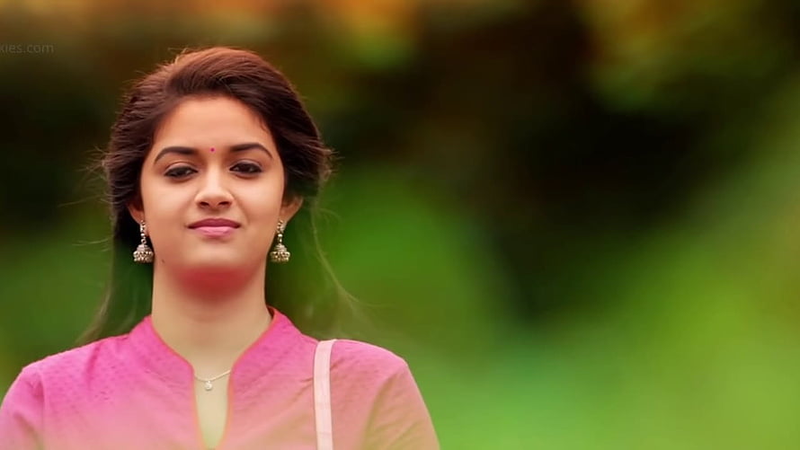 Keerthi Suresh in Pink Traditional Attire with Silver Earrings and Green Background HD wallpaper