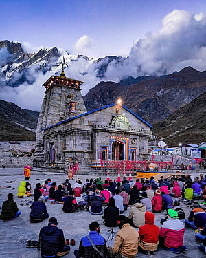 Kedarnath Temple at Dusk with Devotees and Snow-Capped Himalayan Peaks HD phone wallpaper