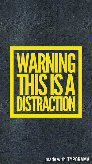 Bold Yellow Warning This Is A Distraction Text on Dark Textured Background HD phone wallpaper