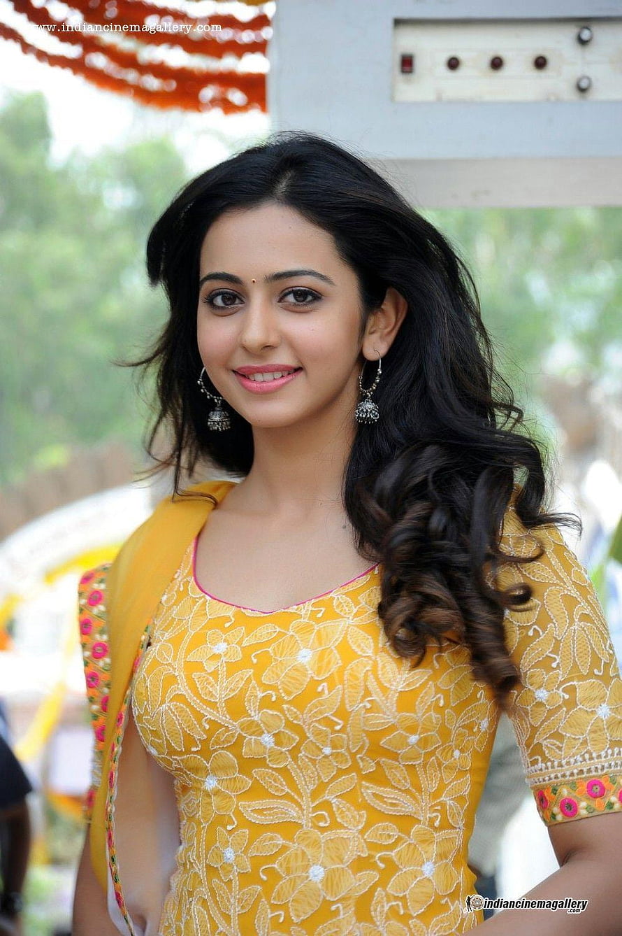 Rakul Preet Singh in a yellow embroidered kurta with floral embroidery and silver jhumka earrings HD phone wallpaper