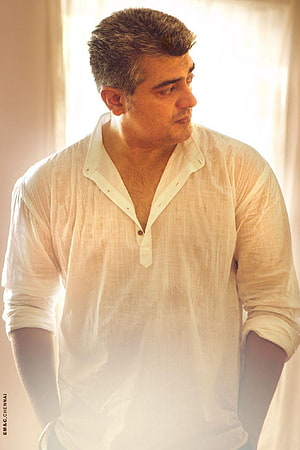 Ajith Kumar in a white linen shirt with soft natural lighting and a contemplative expression HD phone wallpaper