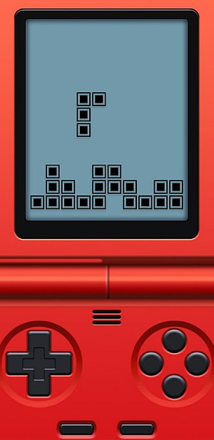 Red Game Boy Console Displaying Tetris Gameplay on Screen HD phone wallpaper