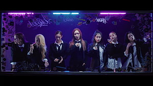 XG K-Pop Group in Black Suits Against Neon Purple Graffiti Wall HD wallpaper