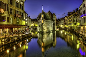 Ile de Beauregard in Annecy France at Night with Canal Reflections and Historic Architecture HD wallpaper