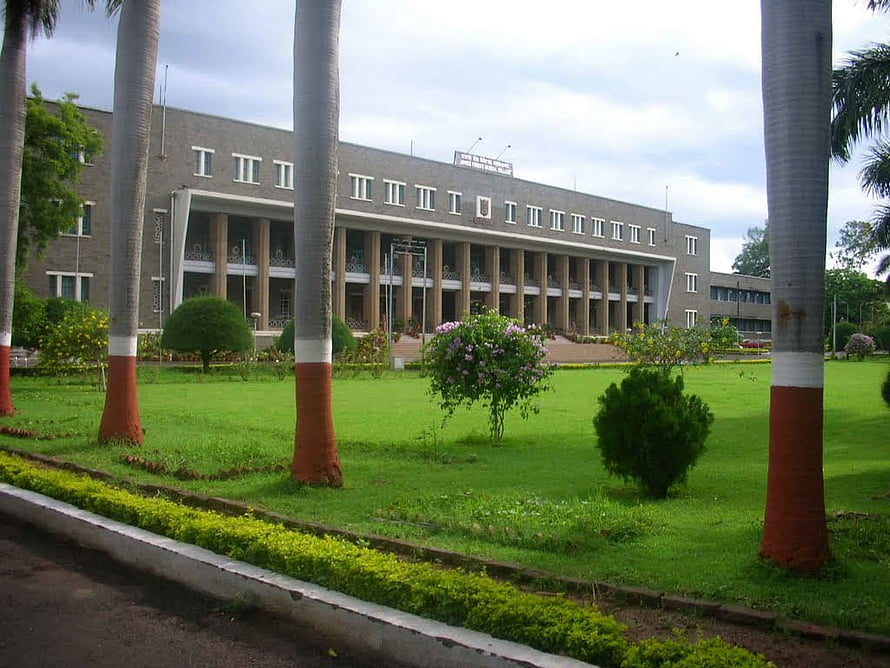 Armed Forces Medical College Pune Campus with Lush Green Lawns and Palm Trees HD wallpaper