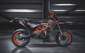 KTM 690 Supermoto R with Orange Frame and Custom Graphics in Underground Garage HD wallpaper