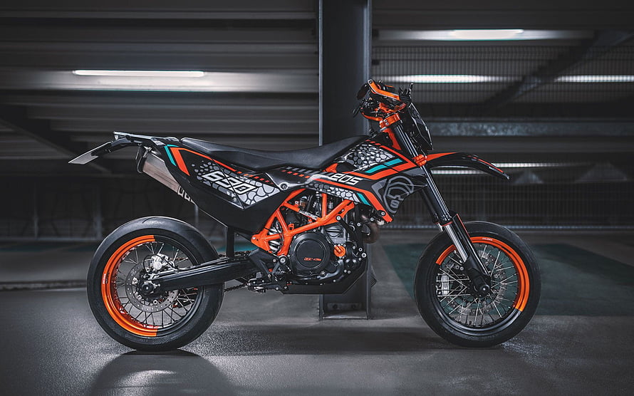 KTM 690 Supermoto R with Orange Frame and Custom Graphics in Underground Garage HD wallpaper
