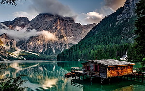Alpine Lake with Wooden Boathouse and Misty Mountain Peaks HD wallpaper