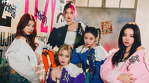 ITZY K-Pop Group in Colorful Streetwear Against Graffiti Wall HD wallpaper
