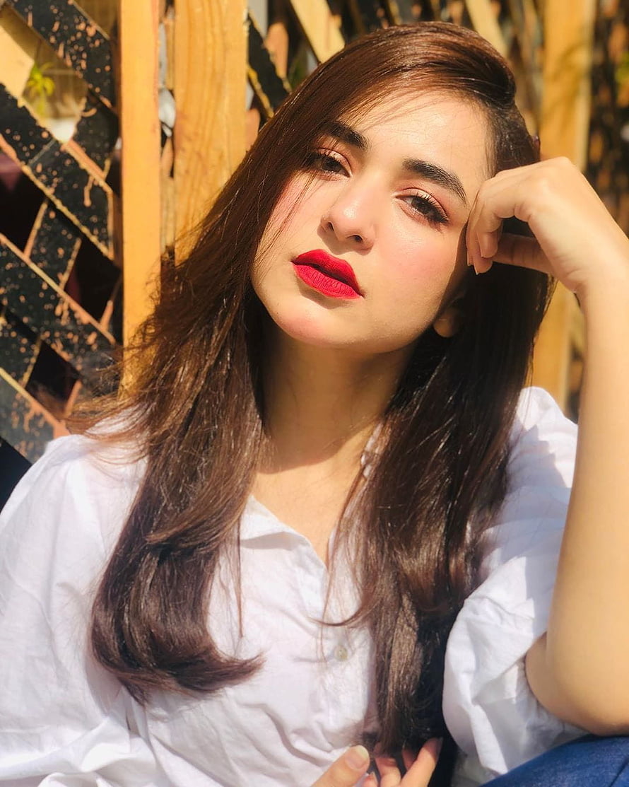 Yumna Zaidi Portrait in White Shirt with Red Lipstick and Long Brown Hair HD phone wallpaper