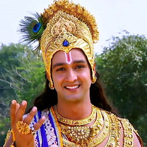 Saurabh Raj Jain as Lord Krishna in ornate golden crown and peacock feather HD phone wallpaper