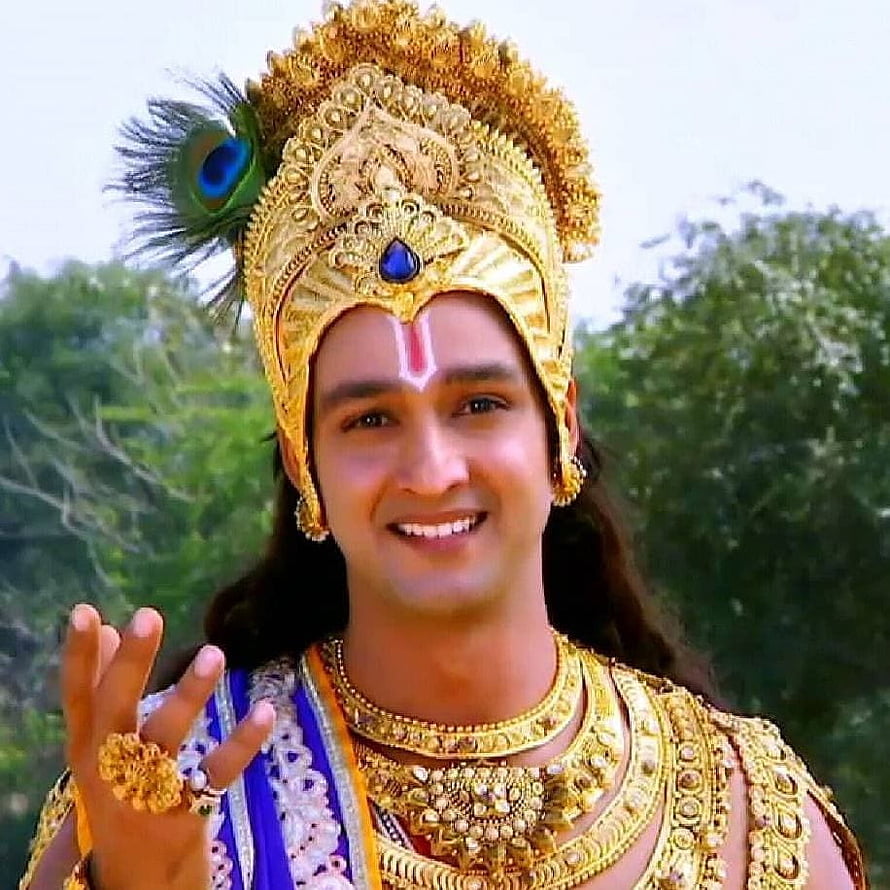 Saurabh Raj Jain as Lord Krishna in ornate golden crown and peacock feather HD phone wallpaper