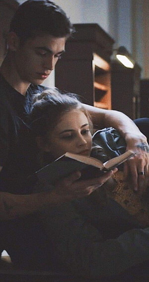 Tessa Young and Hardin Scott Reading Together in Dimly Lit Room HD phone wallpaper