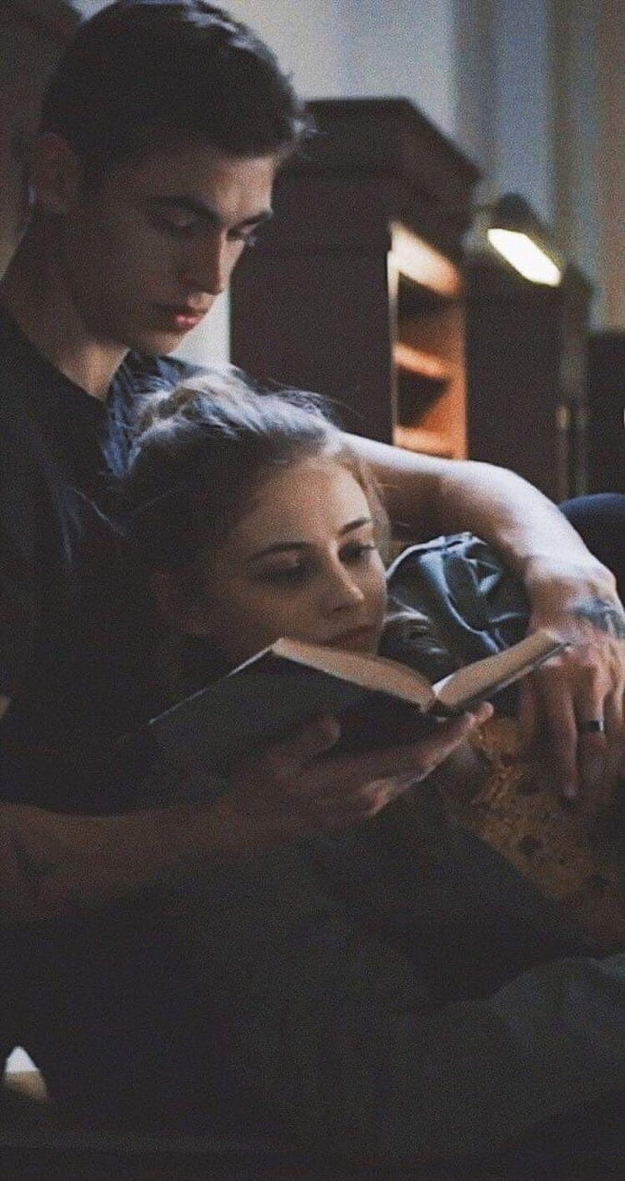 Tessa Young and Hardin Scott Reading Together in Dimly Lit Room HD phone wallpaper