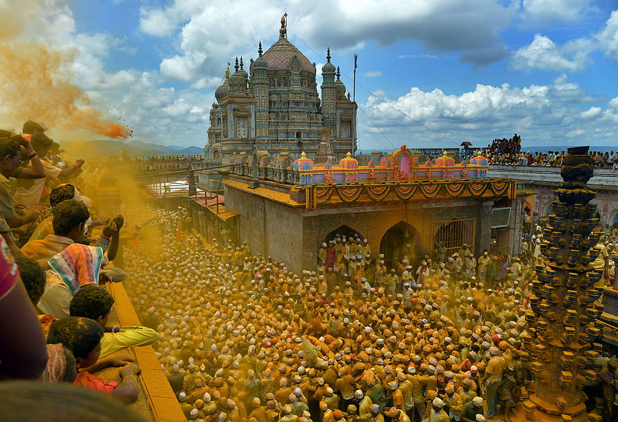 Khandoba Temple Festival with Massive Devotee Crowd and Color Powder Celebration HD wallpaper