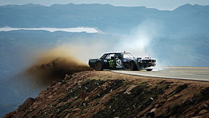 Hoonicorn V2 Rally Car Drifting on Mountain Road with Dust Trail HD wallpaper