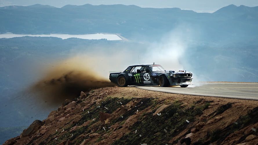 Hoonicorn V2 Rally Car Drifting on Mountain Road with Dust Trail HD wallpaper