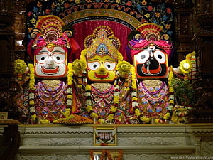 Lord Jagannath Temple Deities Adorned in Ornate Garments and Marigold Garlands HD wallpaper