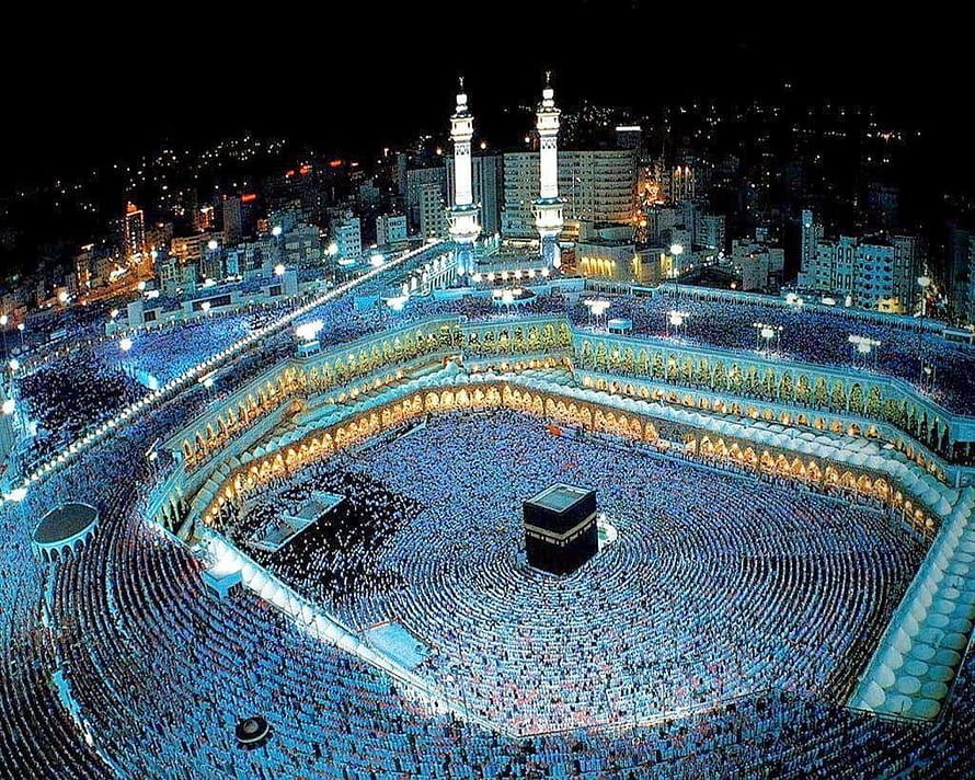 Aerial Night View of the Kaaba and Grand Mosque in Mecca with Pilgrims Performing Tawaf HD wallpaper