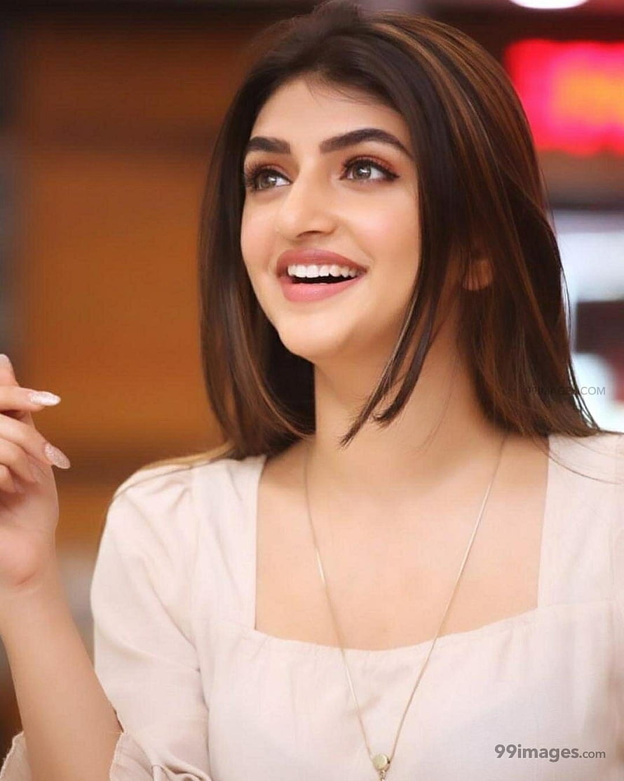 Sree Leela smiling portrait in a cream blouse with a delicate pendant necklace HD phone wallpaper