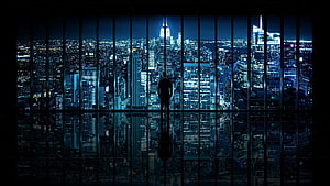 Silhouette of a man standing in a high-rise office overlooking a sprawling city skyline at night, Ultra Windows, windows ultra HD wallpaper
