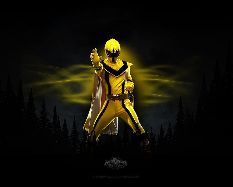 Yellow Ranger from Power Rangers Mystic Force in a dark forest with glowing energy effects HD wallpaper