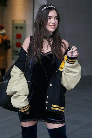 Dua Lipa in Black Velvet Dress and Letterman Jacket with Headband HD phone wallpaper