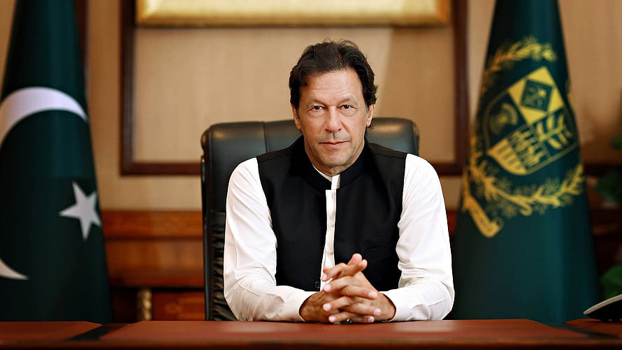 Imran Khan Seated at Desk in Formal Office with Pakistan National Flag HD wallpaper