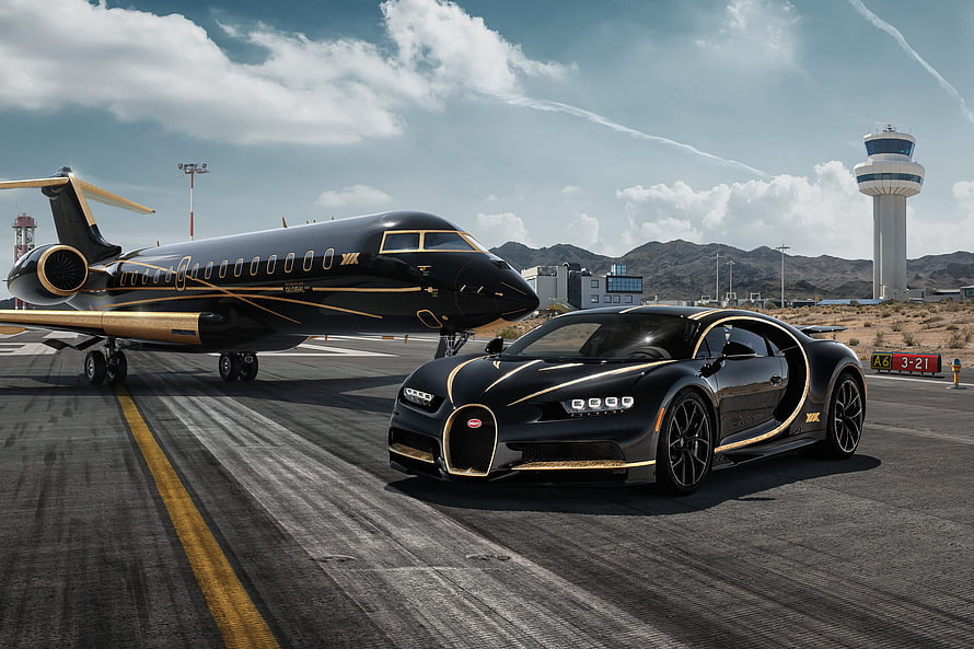 Black and Gold Bugatti Chiron Parked Beside a Private Jet at an Airport Tarmac HD wallpaper