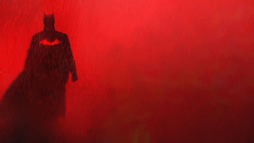 The Batman 2022 Silhouette in Heavy Rain Against a Deep Red Cinematic Backdrop HD wallpaper
