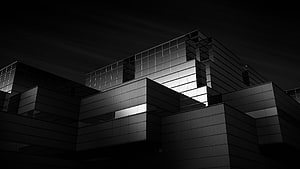 Monochromatic Modern Architecture: Geometric Facade at Night HD wallpaper