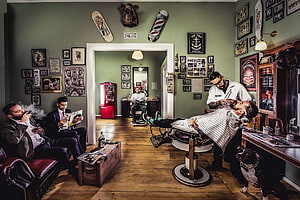 Vintage Barber Shop Interior With Barber Shaving Client And Waiting Customers HD wallpaper