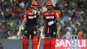 Virat Kohli and AB de Villiers Celebrating a Partnership in RCB Cricket Kit HD wallpaper