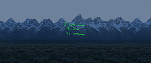 Snow-Capped Mountain Range at Dusk with Green Text Overlay HD wallpaper