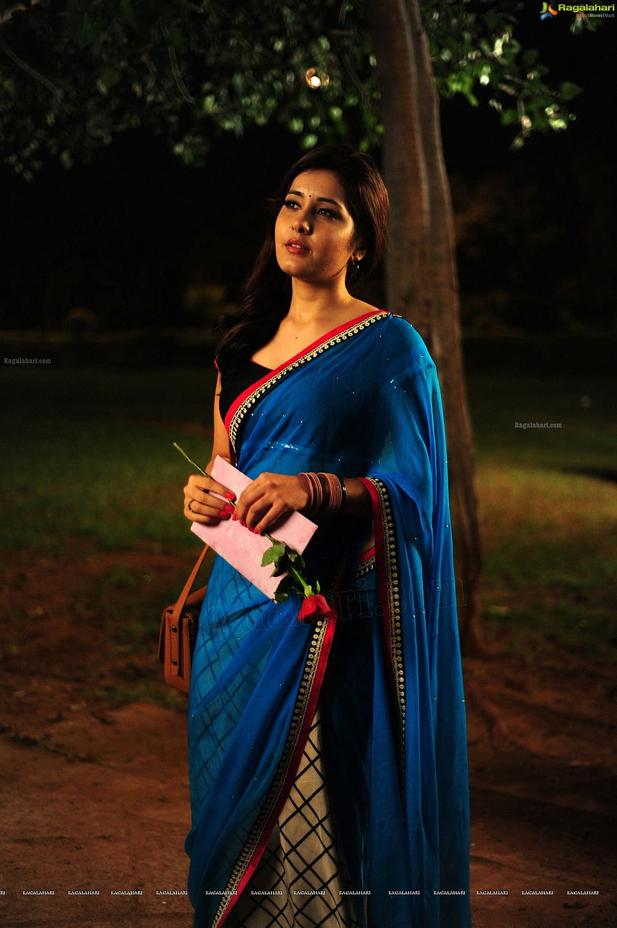 Rashi Khanna in a Blue Saree with Red Border Holding a Rose at Night HD phone wallpaper