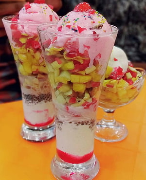 Layered Falooda Dessert with Pink Ice Cream, Fresh Fruit, and Chia Seeds in Glass Cups HD phone wallpaper