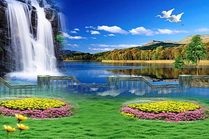 Serene Lake Landscape With Waterfall, Flower Beds, and Flying Cranes Under a Blue Sky HD wallpaper