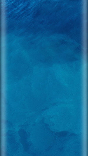 Deep Blue Ocean Water Texture with Soft Ripples and Underwater Light Patterns HD phone wallpaper