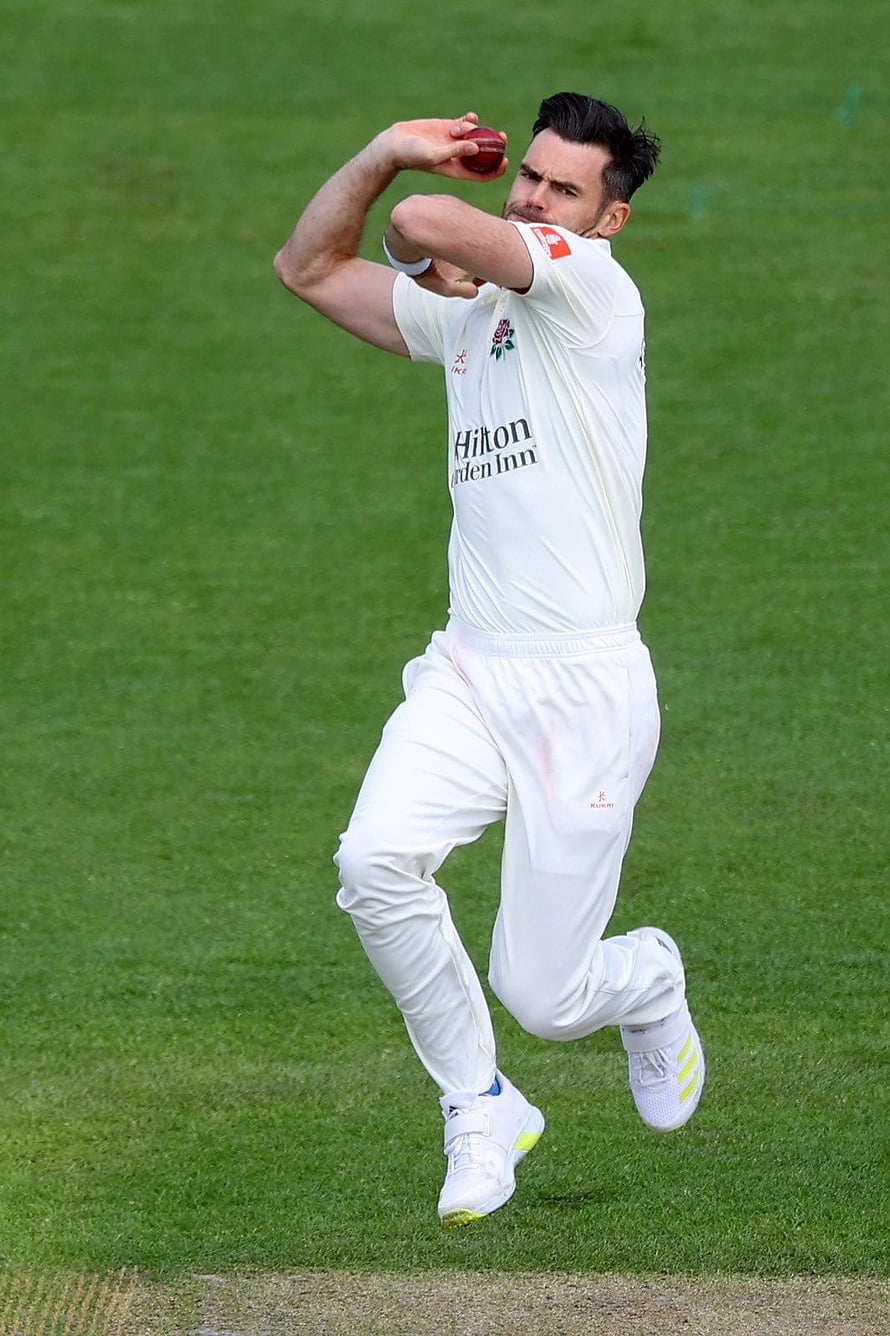 James Anderson in mid-delivery during a Test cricket match in white kit HD phone wallpaper