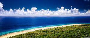 Aerial View of Guam Tropical Beach with Turquoise Water and Lush Green Vegetation HD wallpaper