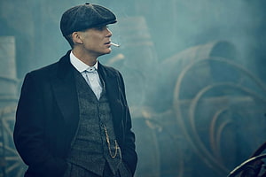 Thomas Shelby in Peaky Blinders Smoking a Cigarette in Industrial Setting HD wallpaper