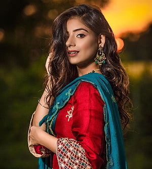 Elegant Woman in Red and Teal Traditional Ethnic Wear with Gold Jewelry HD phone wallpaper