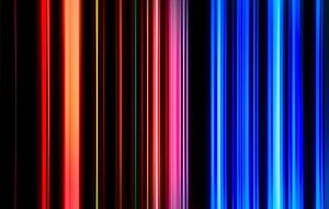 Vibrant Vertical Light Streaks in Red Orange and Blue on Black Background HD wallpaper