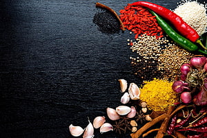 Assorted Spices and Herbs Arranged on Dark Wooden Surface HD wallpaper